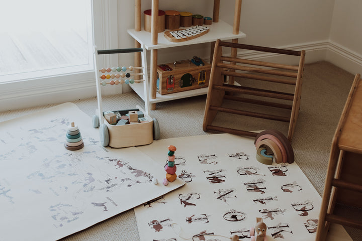 My Little Map, an Australian online store selling reversible vegan leather play ma featuring a limited floral collection of play mats, including the animal world play mat and an alphabet play mat, a great nursery addition to a kids play room.